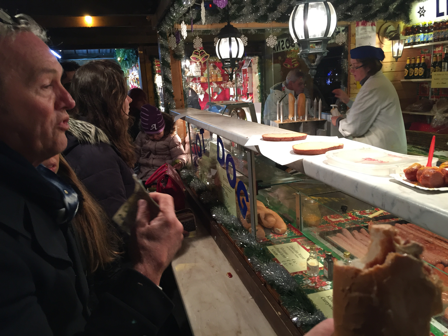 Eating at winter festival , Austria